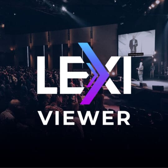 LEXI Viewer logo with live event captioning displayed on a screen during a presentation.